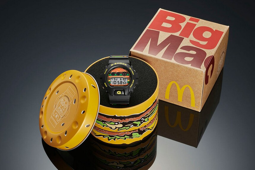 Krabička ve tvaru Big Macu, hodinky s potiskem slavného burgeru.